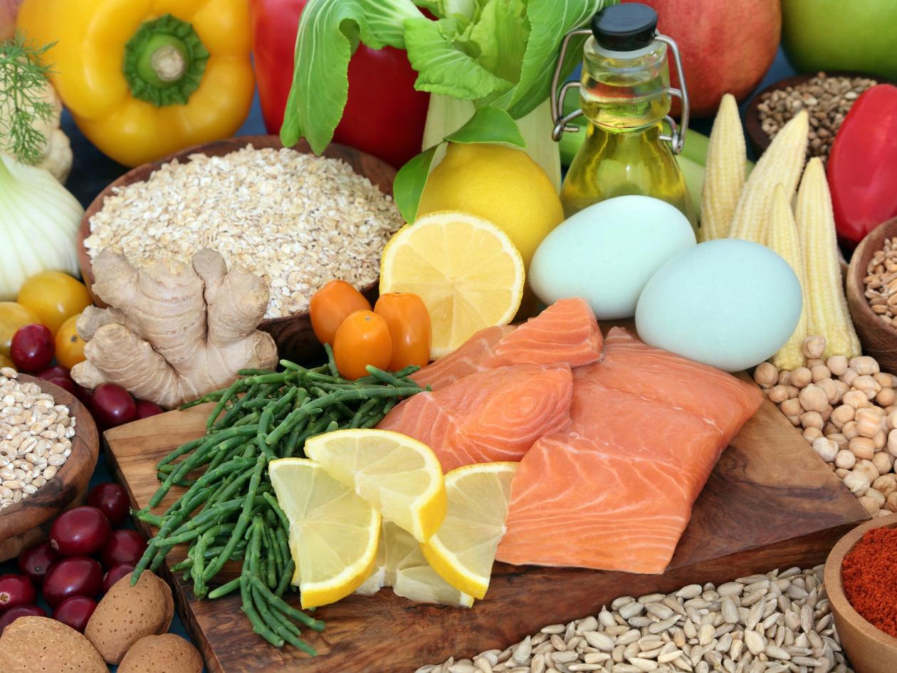Health food for a healthy heart diet with fruit, vegetables, legumes, dairy, olive oil, grains, cere