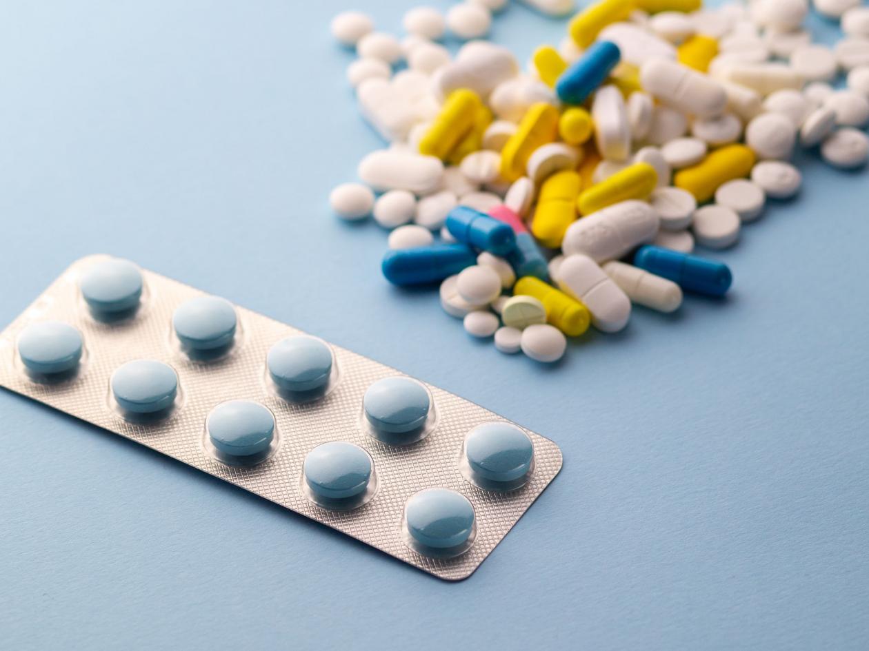 Overdose Of Pills. Medicines. Multicolored Pills Medicines Many Multicolored Pills Hands Background