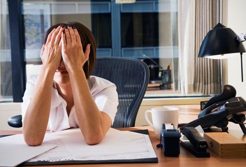 getty rm photo of tired woman at office