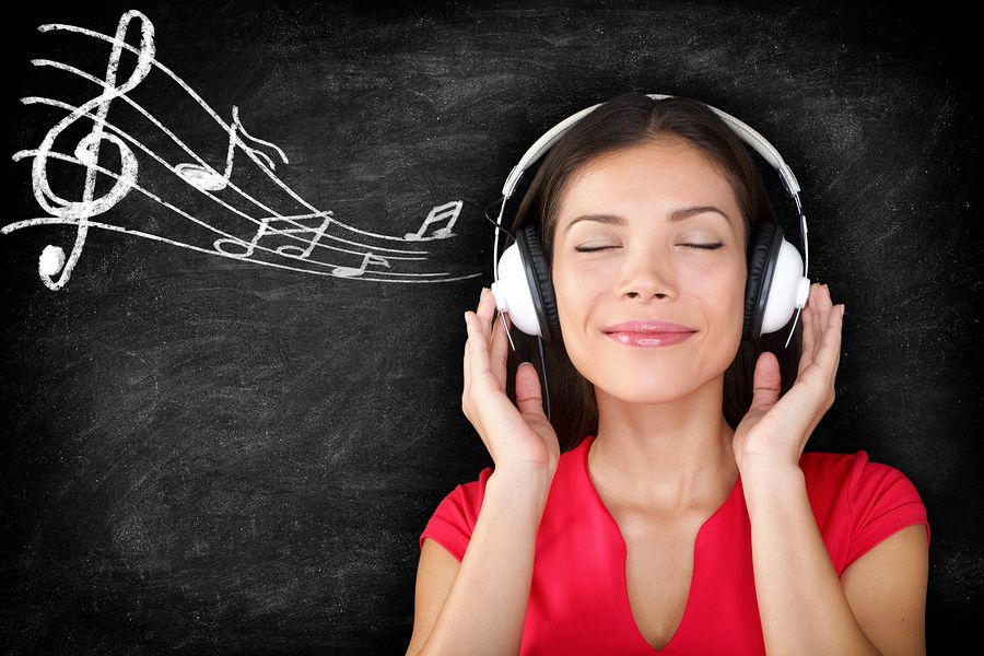 bigstock-Music--woman-wearing-headphon-48690104