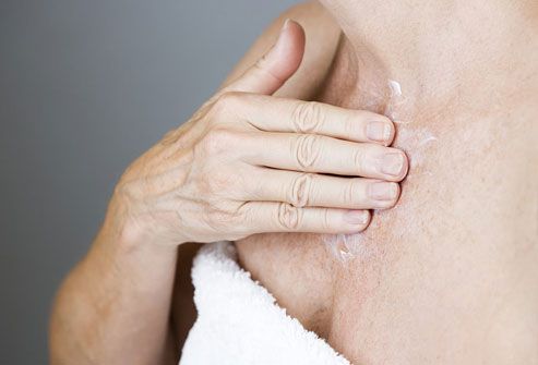 17photolibrary rf photo of woman touching thyroid
