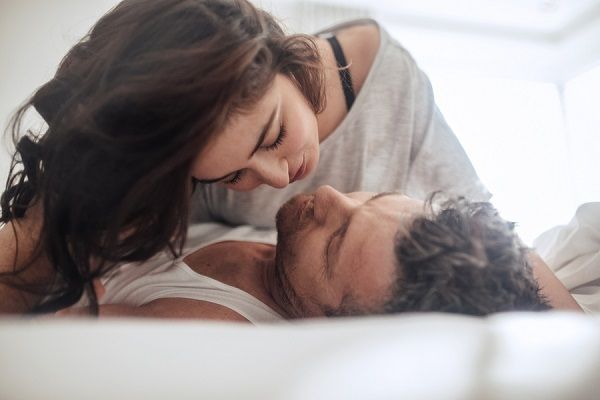 bigstock Young Couple Caressing Lying I 159896384