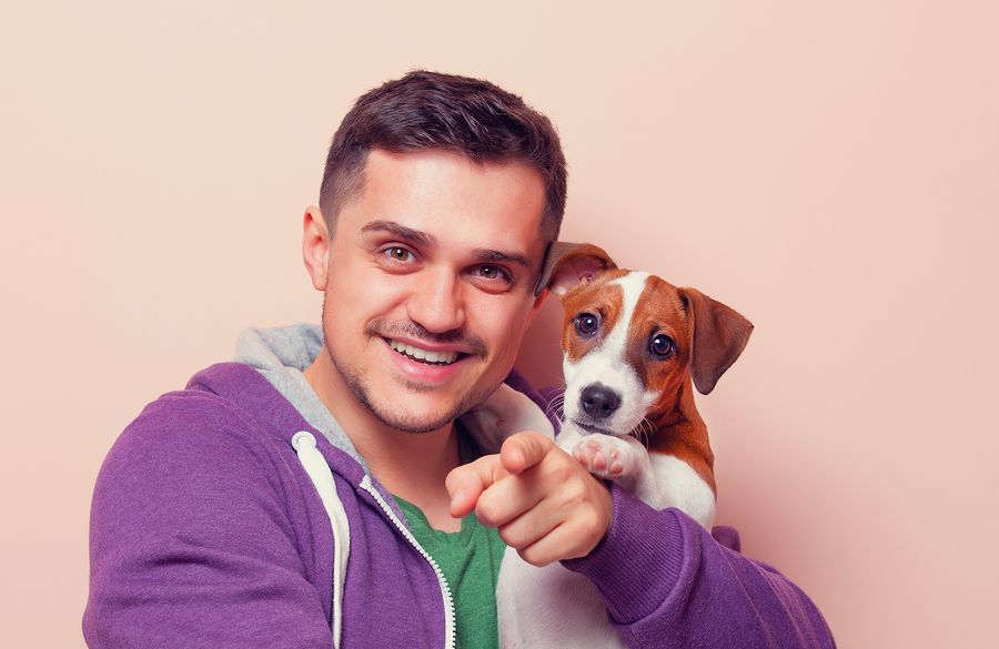 bigstock Man With Puppy 109673168