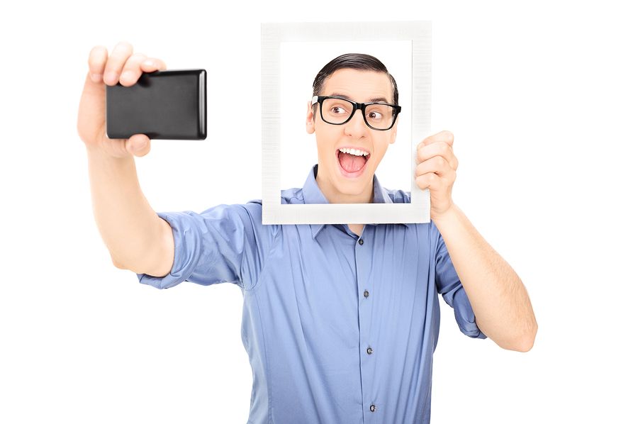 bigstock Man taking a selfie and holdin 62873521