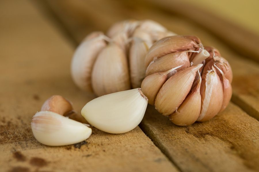 bigstock Garlic on the wooden backgroun 992172381