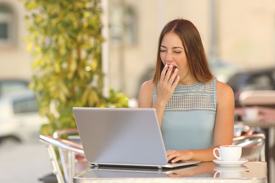 bigstock Woman Yawning And Working In A 84420794