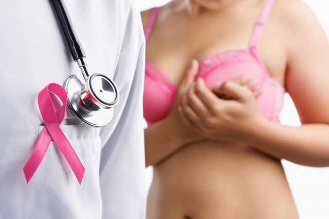bigstock Doctor With Pink Badge And Wom 61869311