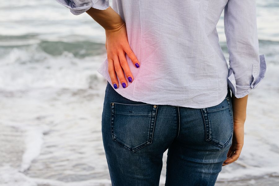 bigstock Woman In Jeans And Shirt Stand 101634884