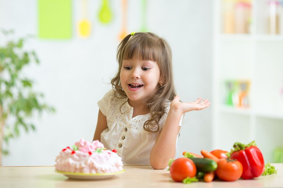 bigstock kid choosing between healthy v 82837160