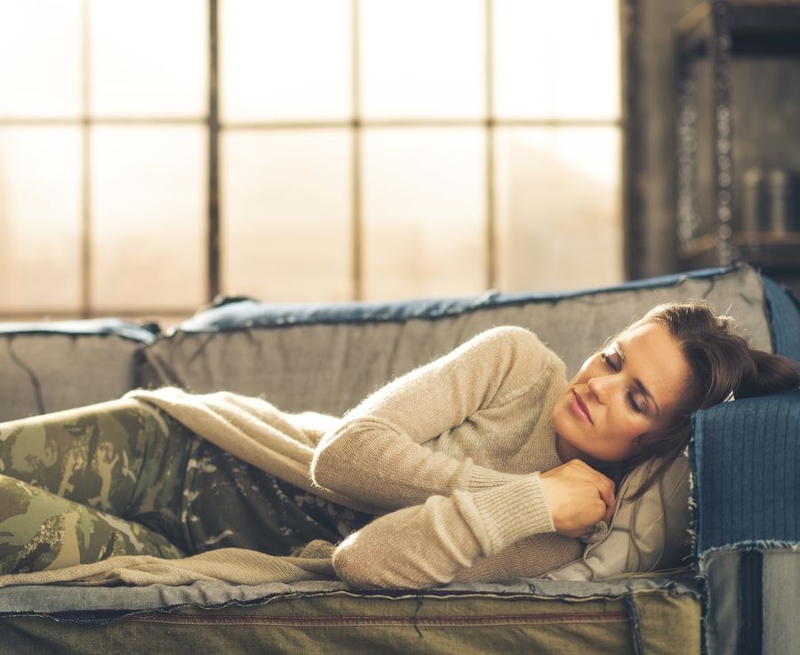 bigstock Woman Napping On A Sofa In A C 90790139