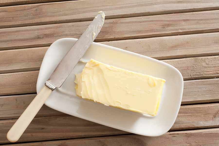 bigstock Pat Of Fresh Farm Butter On A 104890109