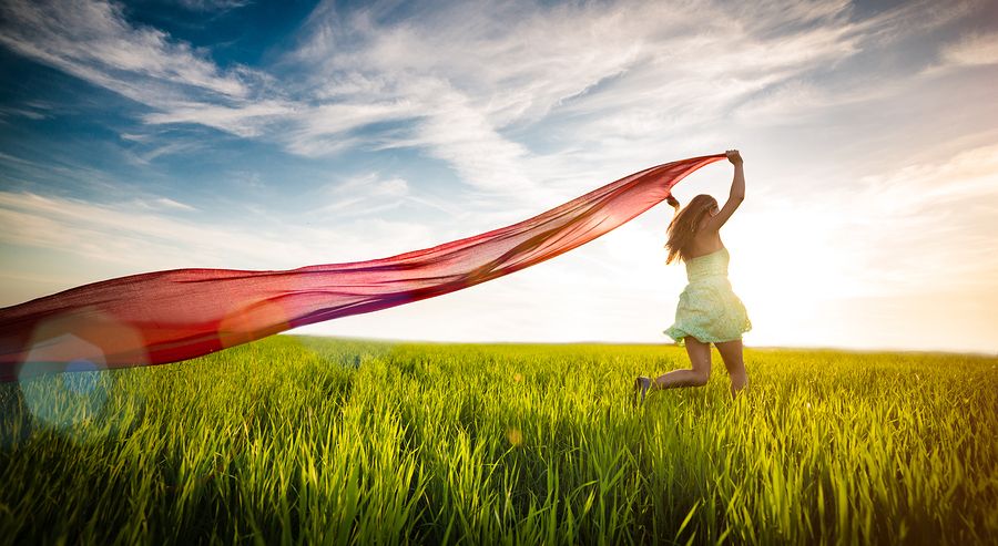 bigstock Young happy woman in wheat fie 87102695