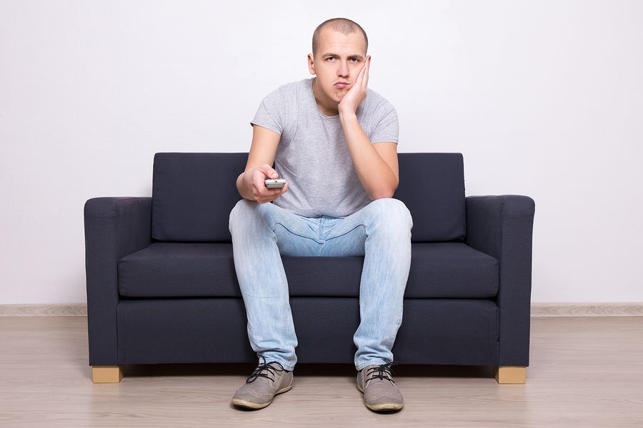 bigstock Bored Man Sitting On Sofa And 114059594