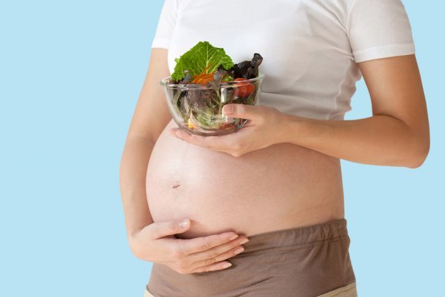 bigstock Pregnant Woman s Belly And Veg 90728213