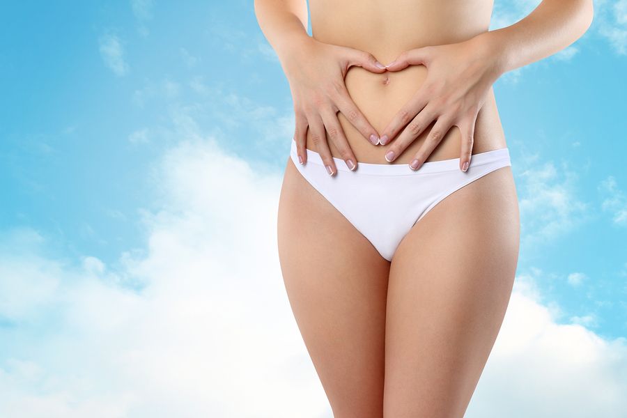 bigstock Woman s hands on stomach in he 91555154
