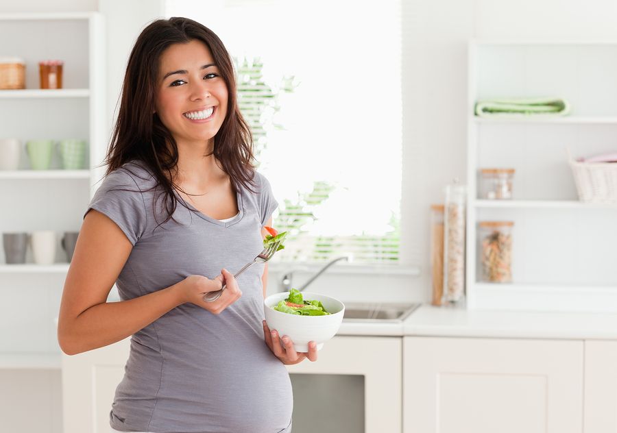 bigstock Attractive pregnant woman hold 22044521