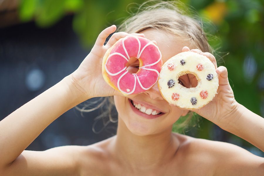 bigstock Cute kid girl eating sweet don 91135847