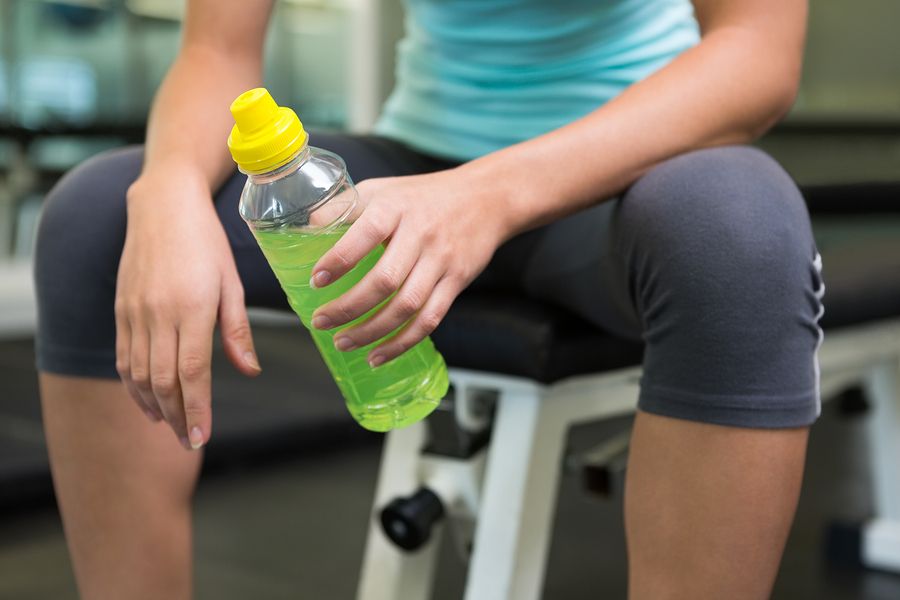 bigstock Fit woman sitting on bench hol 69558772
