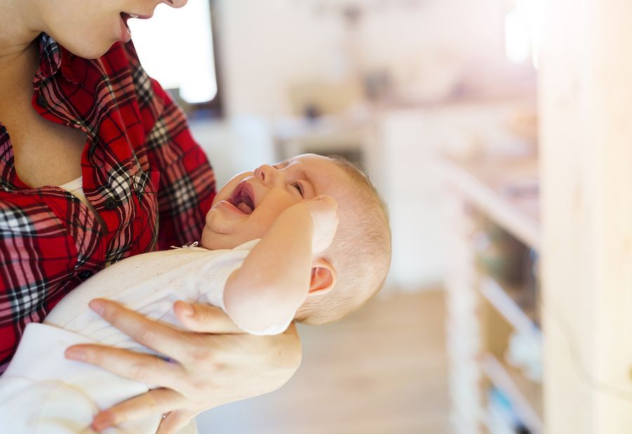 bigstock Little baby girl with her moth 84434366