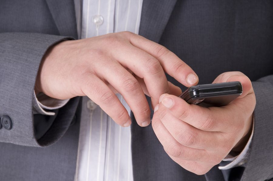 bigstock Cell Phone in businessman hand 14221205