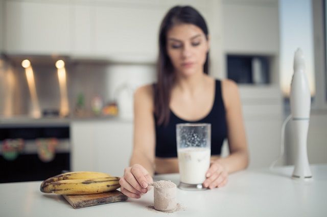 bigstock Woman making sweet banana choc 118964120