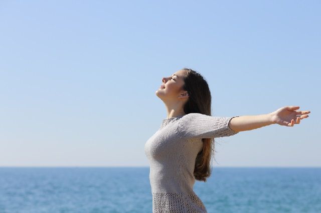 bigstock Happy Woman Breathing Deep Fre 61556255