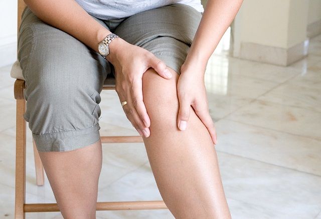 bigstock Woman suffering from pain in k 18060380