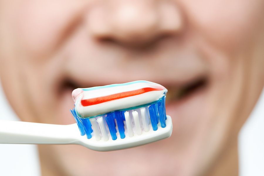 bigstock Man Brushing Teeth Toothbrush 83765798