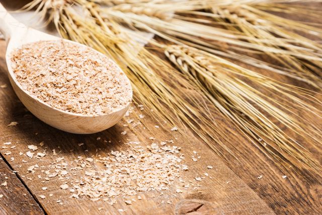 bigstock Wheat Bran In Wooden Spoon Wit 104434739