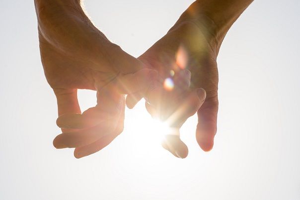 bigstock Couple Holding Hands Toward Th 87959495