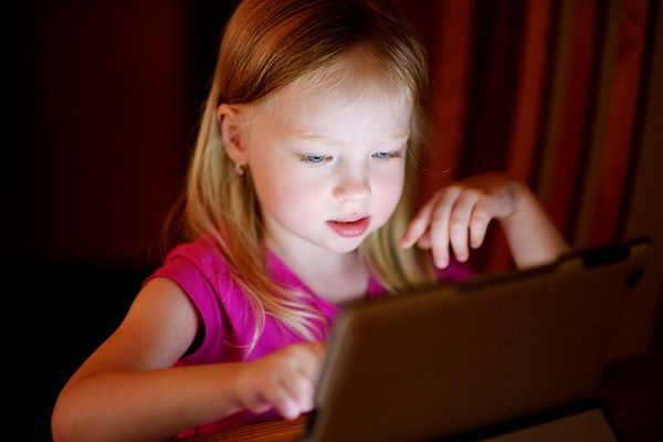 bigstock Adorable Girl Playing With A D 165702353