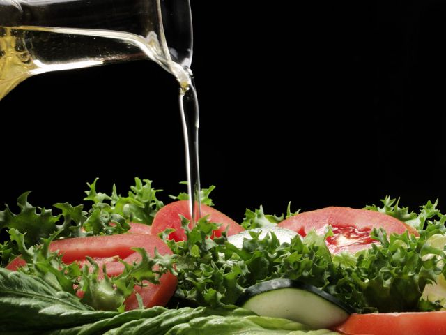 bigstock Pouring olive oil and fresh sa 27002423