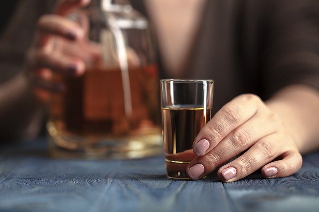bigstock Drunk Woman Holding An Alcohol 179222347