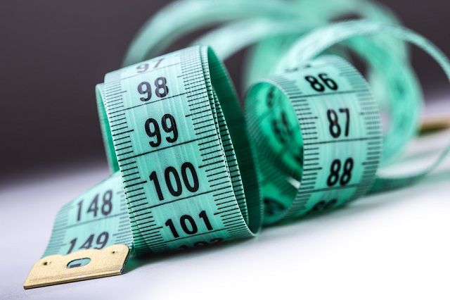 bigstock Curved measuring tape Measuri 114133757