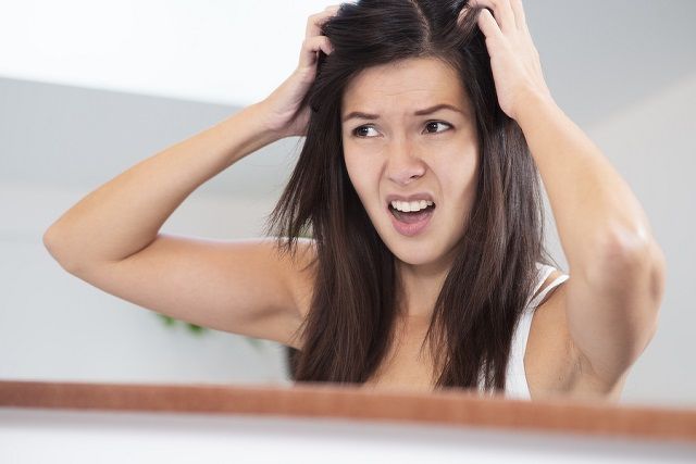 bigstock Woman Having A Bad Hair Day 54323297