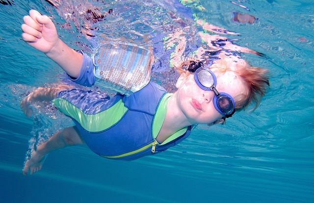 bigstock Young Boy Swimming Underwater 756837