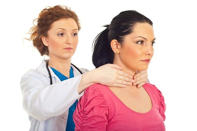 bigstock Endocrinologist Examine Thyroi 19618823