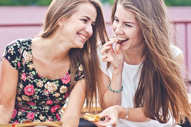 bigstock Two young female friends laugh 83990369