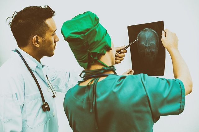 bigstock Doctors Looking At X ray Film 191497315