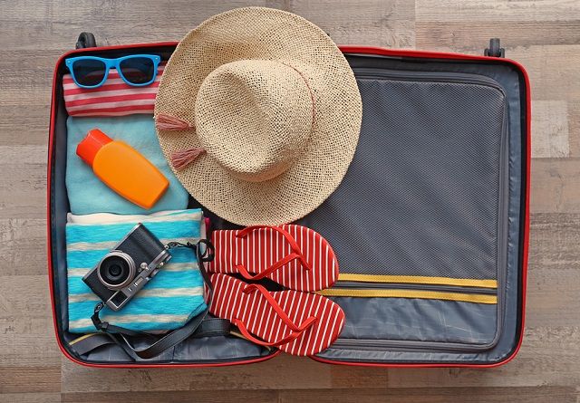 bigstock Open suitcase packed for trave 169807733
