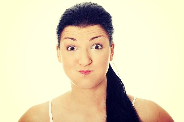 bigstock Young woman with bad hiccup 79408432
