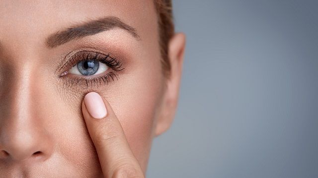 bigstock woman checking wrinkles around 160059839