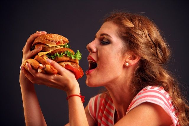 bigstock Woman eating sandwich Girl wi 171355184
