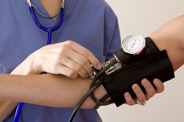 bigstock Doctor or nurse taking a patie 15700058