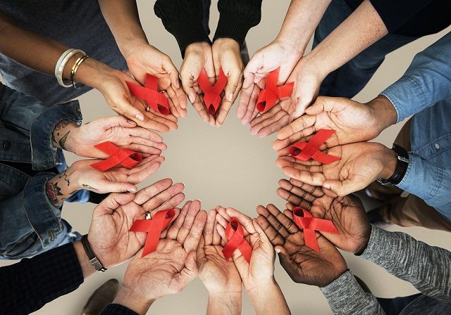 bigstock Group of hands holding red rib 174968608