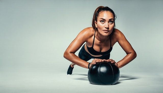 bigstock Fit Woman Doing Push Up On Med 196166506