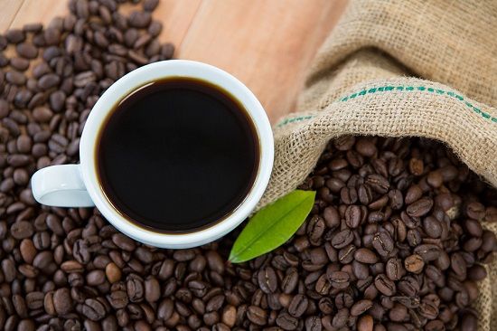 bigstock Coffee cup with coffee beans a 184351492