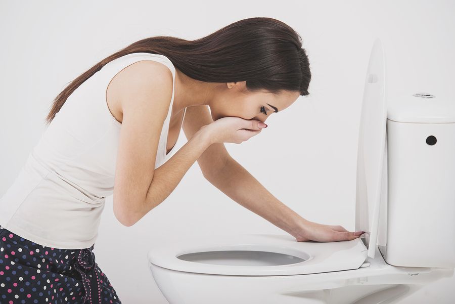 bigstock Young Woman Vomiting Into The 229447957