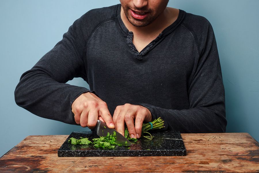 bigstock Man Chopping Herbs 57615029