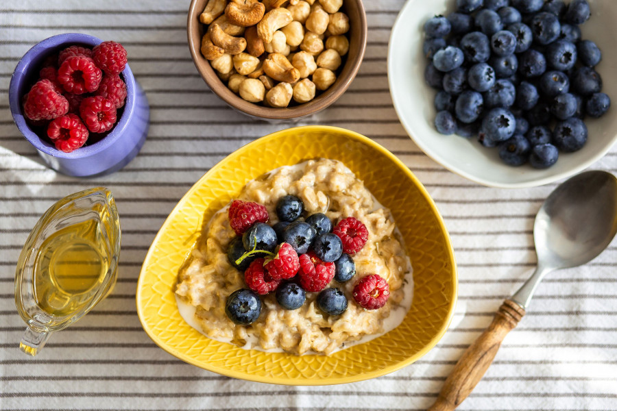 Oatmeal with berries and honey for breakfast.Beautiful healthy breakfast.Proper nutrition of the stu